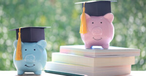 Graduation hat on piggy bank with on nature green background, Saving money for education concept